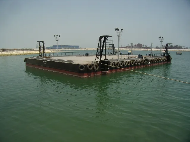 NASS 120 foot class deck barge afloat