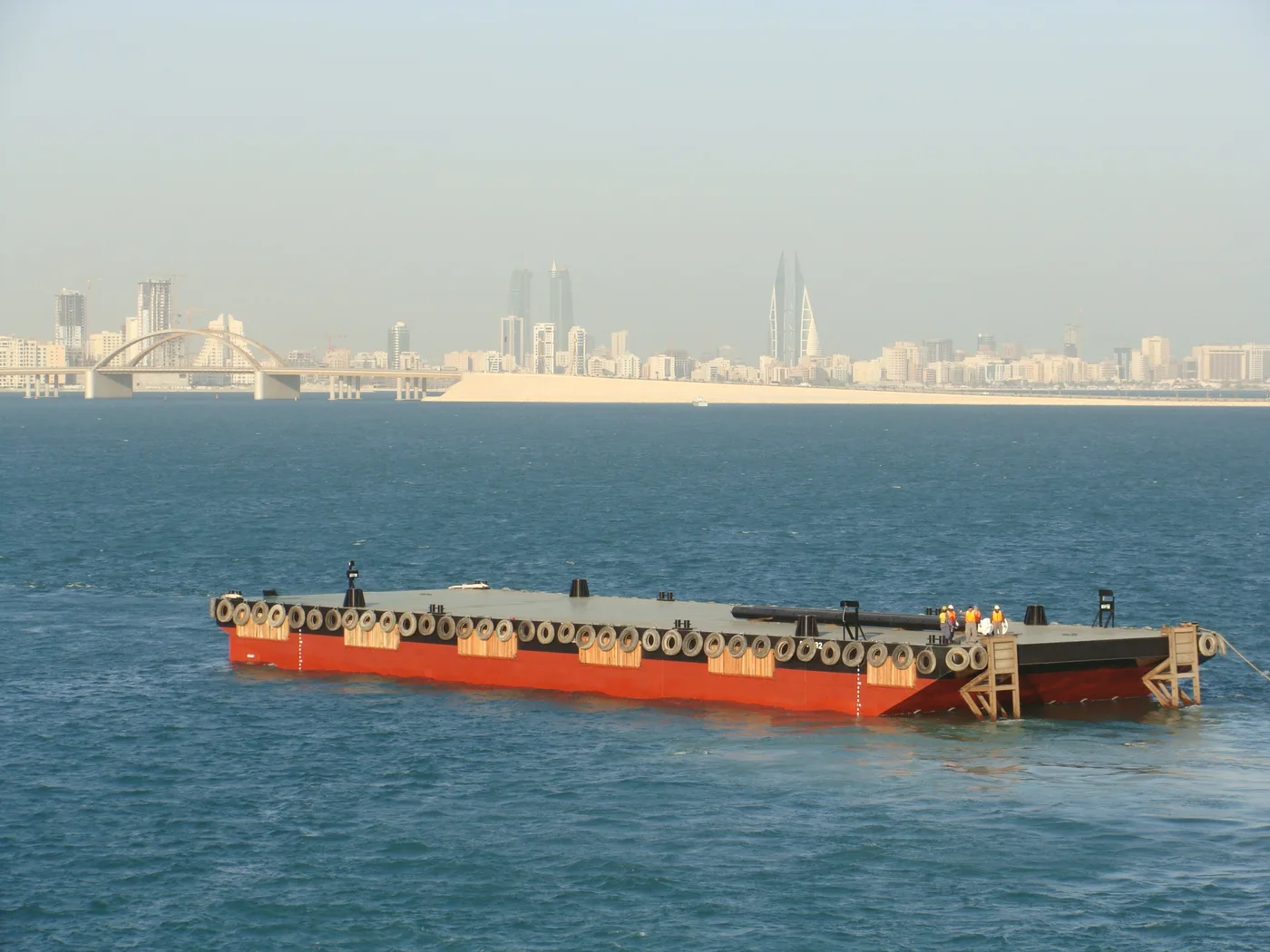 NASS 150 foot class flat top barge under tow off Bahrain